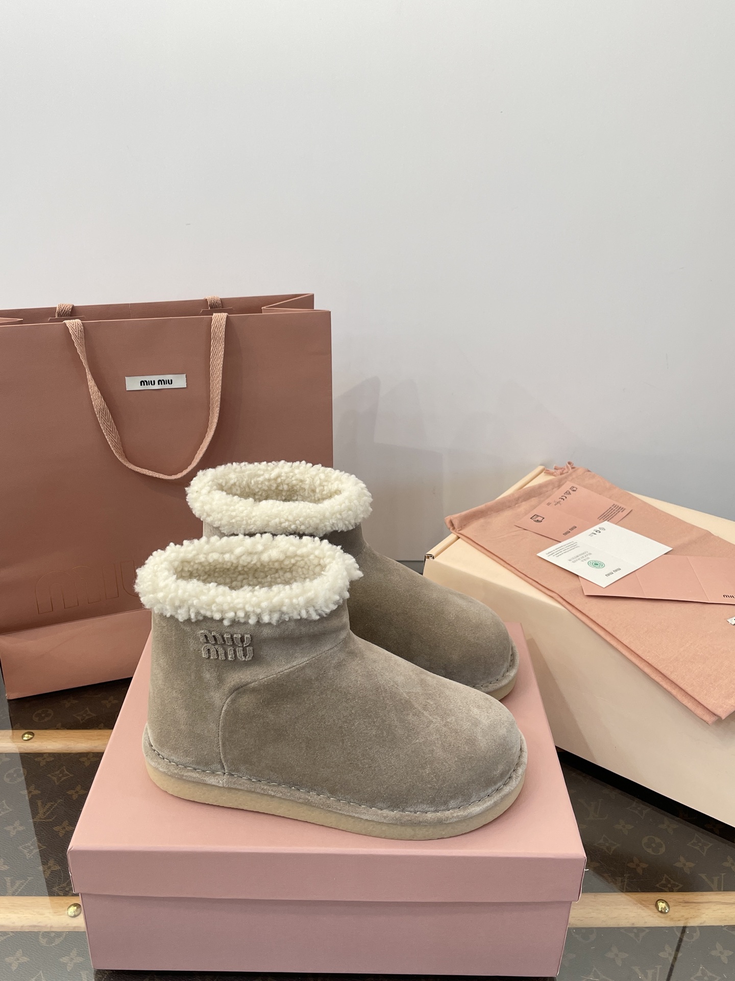 miumiu Suede and shearling booties